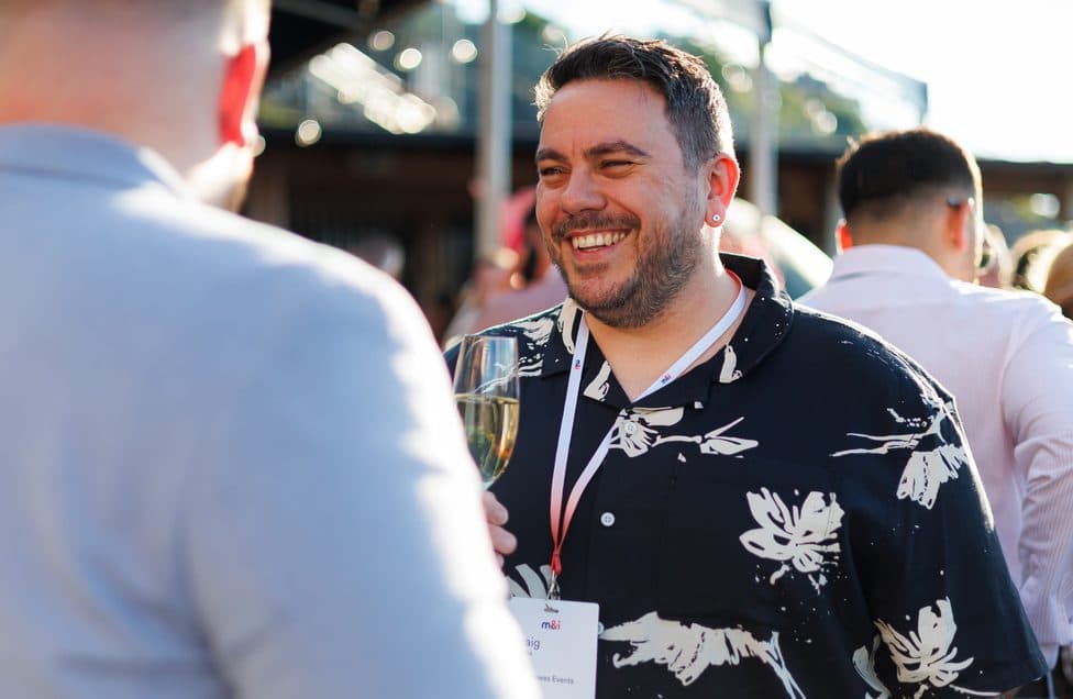 Delegates laughing together at an M&I networking reception