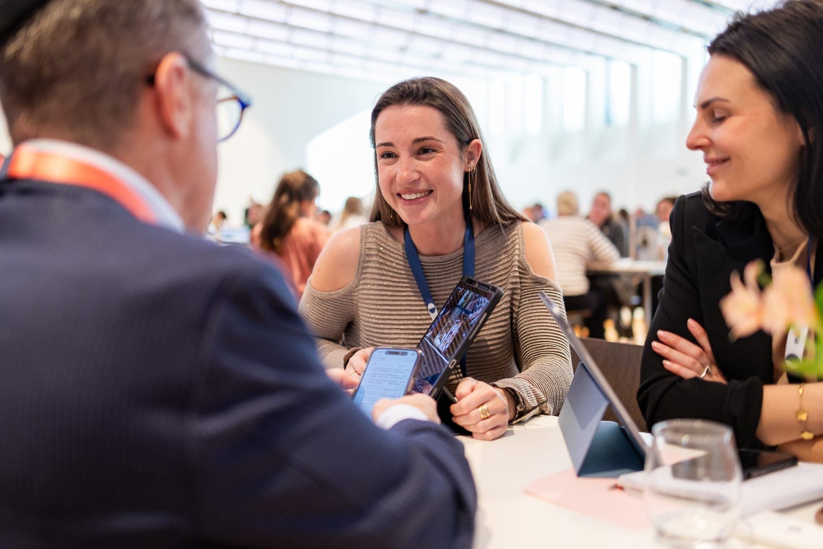 A supplier in conversation with buyers at an M&I event